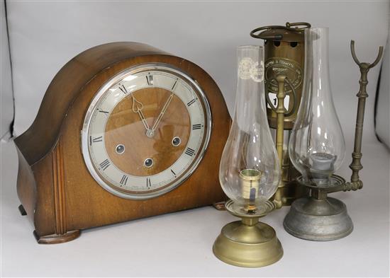 A miners lamp and two other and a clock